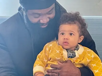 Man-With-Baby-Wearing-Yellow-Sweater-at-East-Ottawa-Kids.jpeg