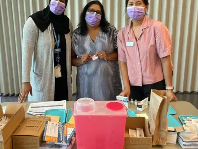 Three-Staff-at-South-East-Ottawa-in-Purple-Masks.jpeg